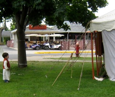 Pip Standing Outside the Logsdon Tent at Site B