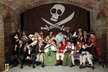 The Mercury crew pointing weapons at each other