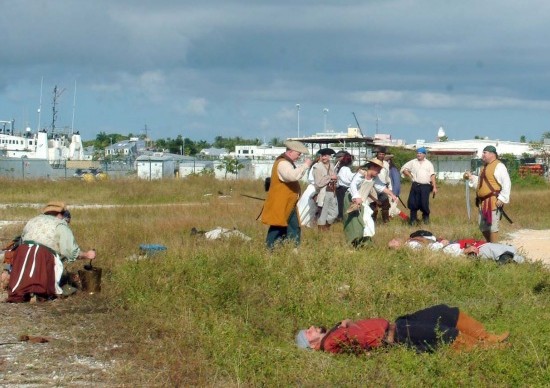 Silkie ministering to the wounded while the pirates confer