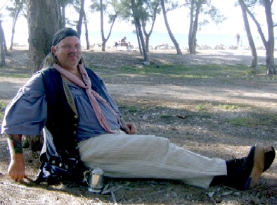 John reclining against a tree