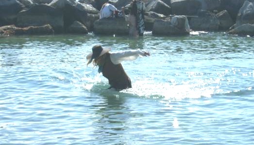 Captain Sterling falls into the water