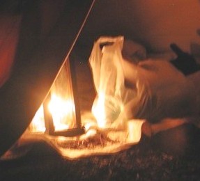 A bag lit by a lantern