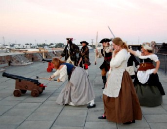 Madam Grace prepares to fire the cannon