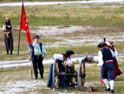 Pirates readying a cannon to fire