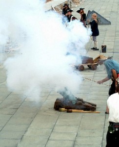 A pirate cannon firing.