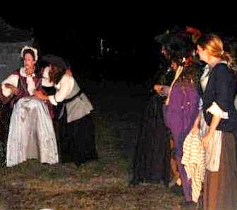 The women gathered aroiund the pregnant Lily