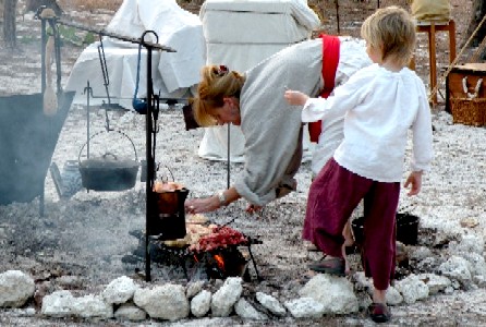 Lady Constance making the chicken for the salad 