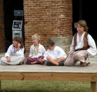 Grace, Ryan, Zach and Youngblood sitting on a bench