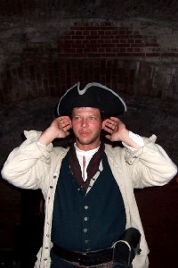 Edward with his hands to his ears