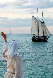 Lilly McKinny waving farewell to a ship