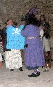 Lily presents Fayma's signed shirt