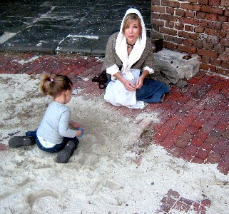 Brig and Kiera playing in fort sand
