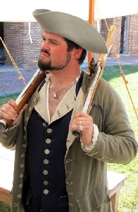 Jack Roberts holding two guns