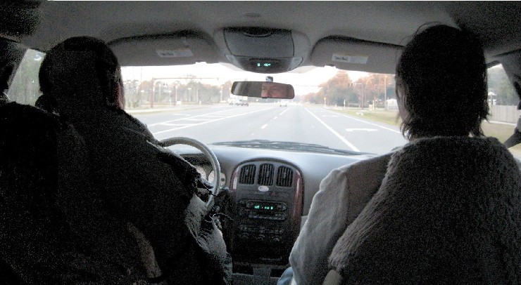 Conrad and Patrick in the front of the van on the way to the airport