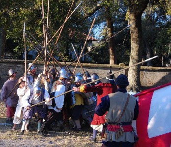 The pikesmen push hard against each other