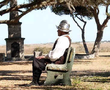 Re-enactor sitting on a concrete bench