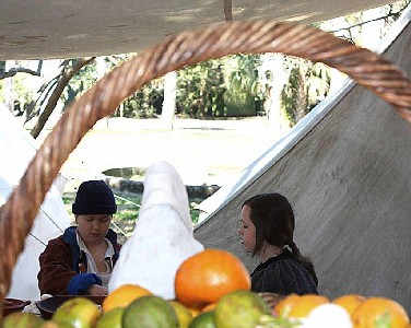 Gretchen and friend seen through a basket handle