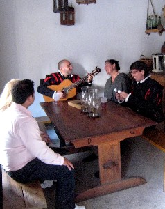 People gathered round the Spaniard playing guitar